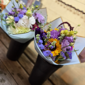 Two wrapped bouquets of flowers